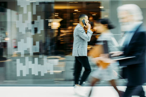 istock Businessman walking along the corridor, blurred motion 1200097891