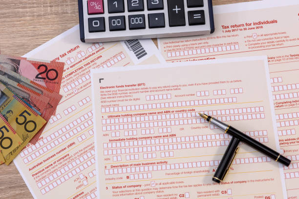 istock Australian tax declaration and pen on wooden table 1200098452
