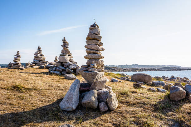 istock Cairns by the seaside on a sunny day. 1200098566