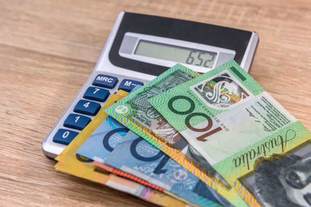 istock Australian money aud with calculator on desk. 1200100100