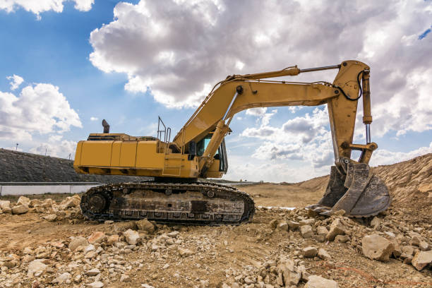 istock Excavator in a quarry extracting stone 1200103353