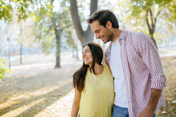 istock Couple in public park 1200106515