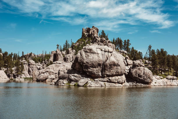 Rocky hills by a lake, Black Hills, South Dakota Rocky hills by a lake, Black Hills, South Dakota custer state park stock pictures, royalty-free photos & images