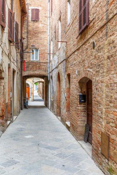 istock Empty alley with old brick houses 1200109546