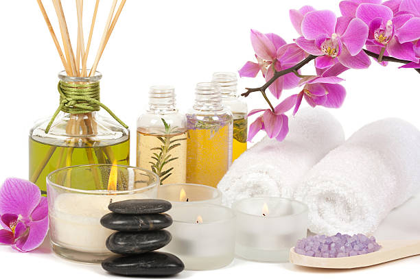 istock Candles, incense, smooth stones, towels and orchids at a spa 120011077