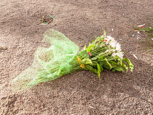 istock flowers on the ground, discarded bouquet 1200113713