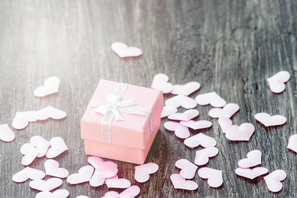 istock Gift box with hearts on a wooden background. Valentine`s day. 1200114902