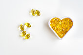 Omega-3 fish oil capsules in the shape of a heart for the cardiovascular system of the body. View from above