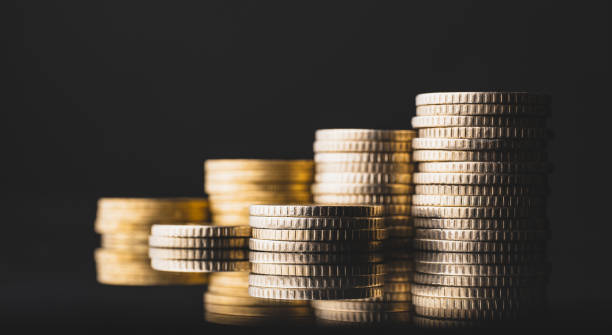 Coins on black background stock photo