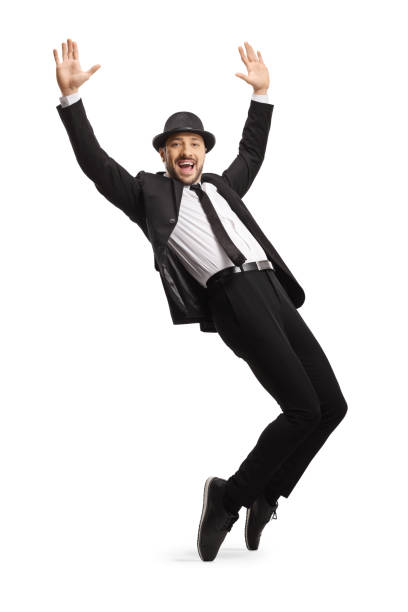 istock Man in suit dancing and raising hands 1200115221