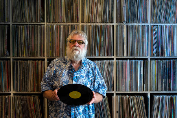 istock Record collector in front of his collection 1200121501