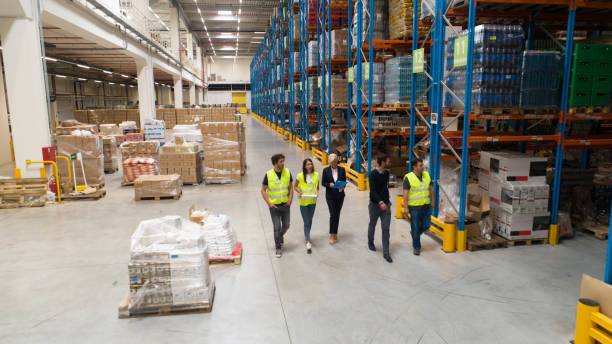 istock Warehouse staff meeting, workers with mnagers 1200121540