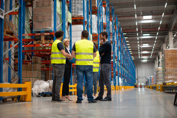istock Warehouse staff meeting, workers with mnagers 1200121567