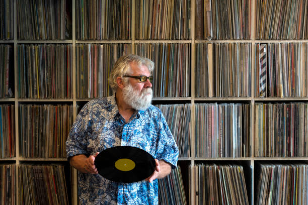 istock Record collector in front of his collection 1200121623