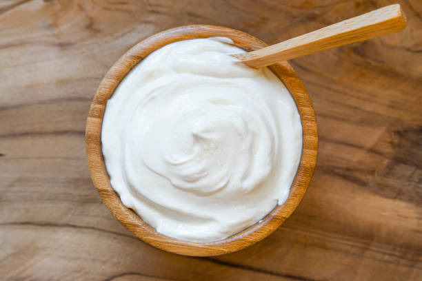 istock Healthy breakfast with Fresh greek yogurt on background 1200121896