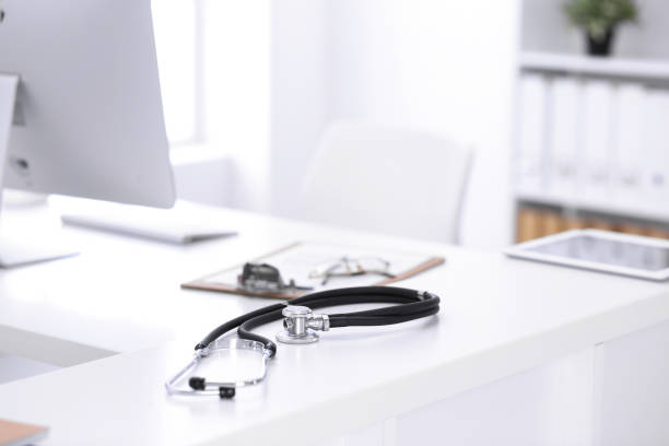 istock Stethoscope, prescription medical form lying on a table with pc computer. Medicine or pharmacy concept. Medical tools at doctor working table 1200122777
