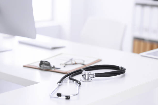 istock Stethoscope, prescription medical form lying on a table with pc computer. Medicine or pharmacy concept. Medical tools at doctor working table 1200122780