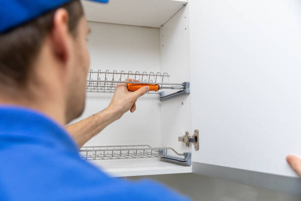istock furniture service worker screwing kitchen cabinet dish rack 1200125620