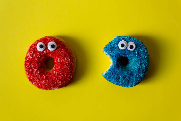 Colorful donuts with googly eyes stock photo