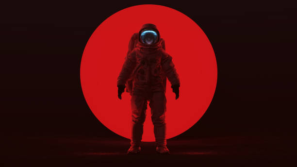 istock Astronaut in a Red Space Suit Standing in a Alien Void with a Clear Visor Woman's Face with a Big Red Alien Sphere in a Dark foggy void Front View 1200126960