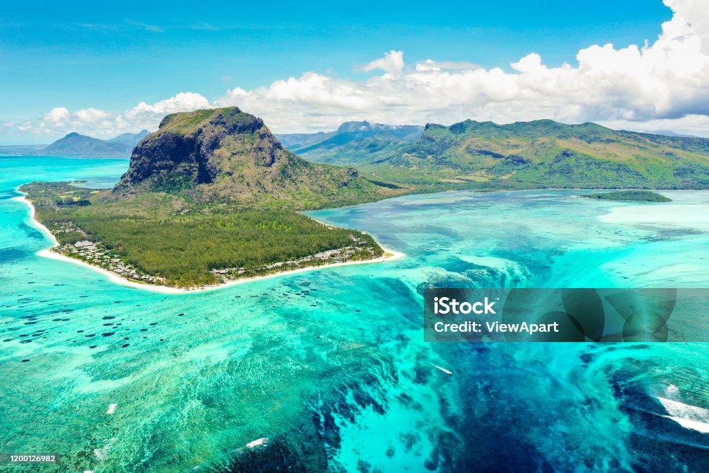 Aerial panoramic view of Mauritius island - Detail of Le Morne Brabant mountain with underwater waterfall perspective optic illusion - Wanderlust and travel concept with nature wonders on vivid filter Mauritius Stock Photo