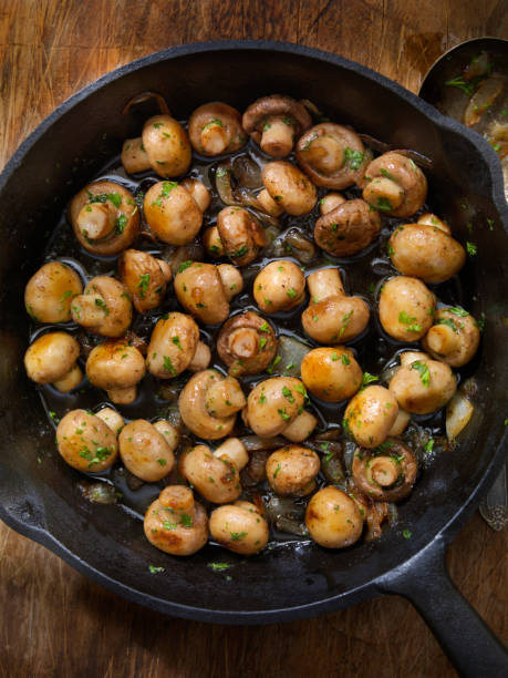 Butter and Garlic Mushrooms with Onions Butter and Garlic Mushrooms with Onions crimini mushroom stock pictures, royalty-free photos & images