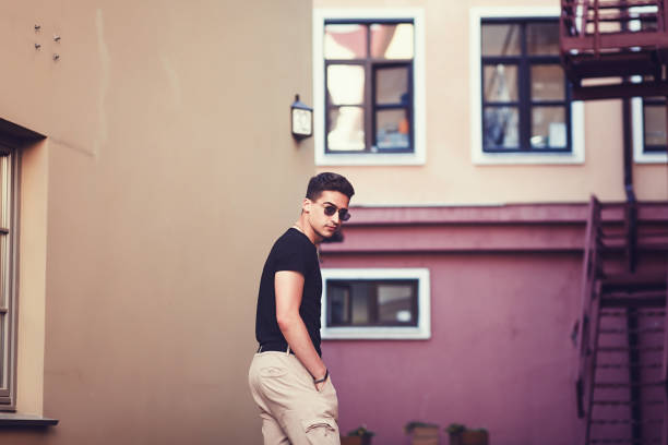 handsome male model with wearing black t-shirt  in casual urban style