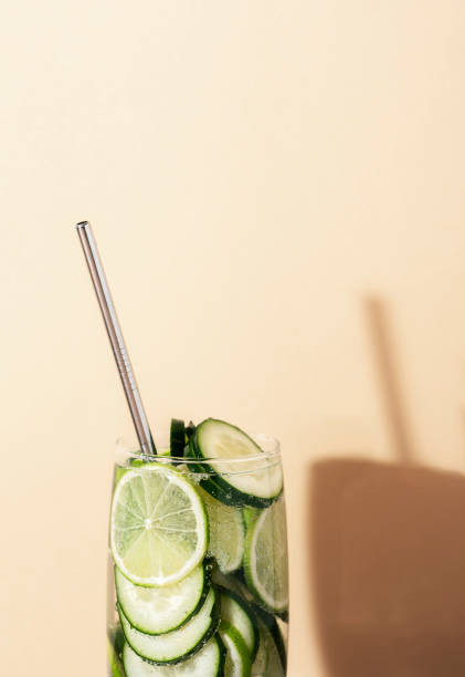 istock Lemonade glass with cucumber and lime. Summer cocktail. Close-up 1200131345