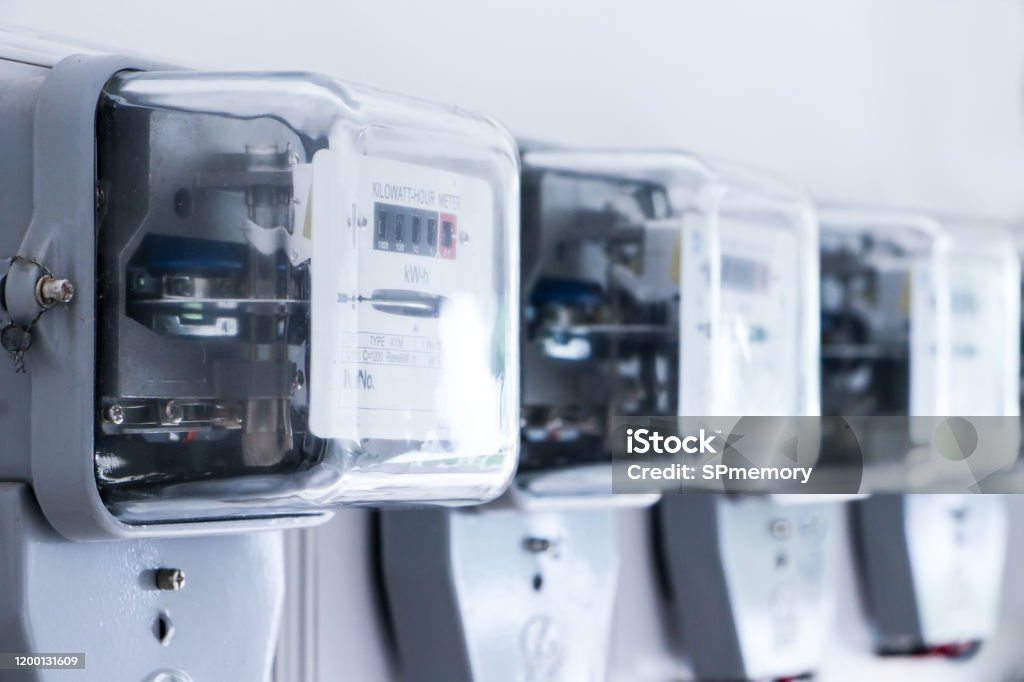 Electrical equipment.energy meter is a device that measures the amount of electric energy consumed by a residence, a business, or an electrically powered device Electricity Stock Photo