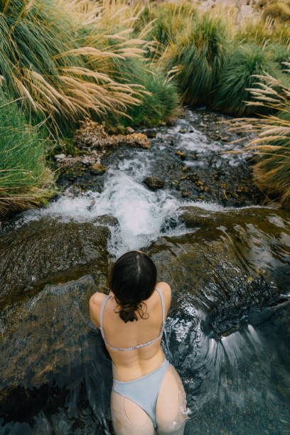 istock Woman in hot spring in Atacama desert 1200132675