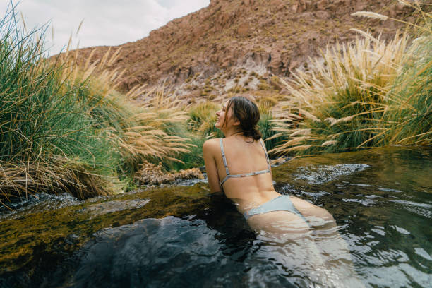 istock Woman in hot spring in Atacama desert 1200132706