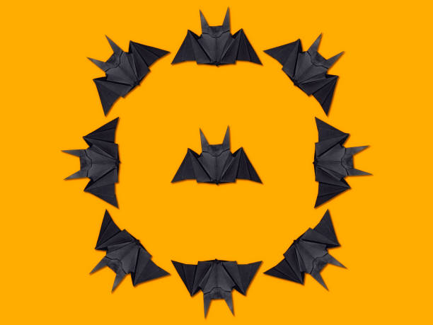 istock Halloween concept. Circle of paper bats using origami technique 1200133109