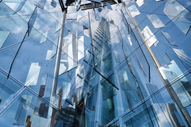 istock Abstract reflections of finance buildings seen from below 1200133249