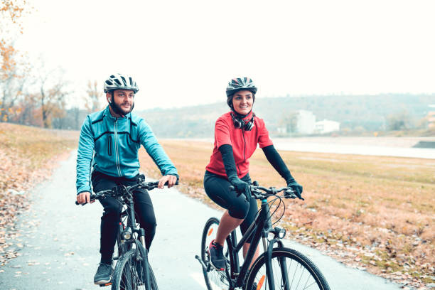 istock Cute Cyclist Couple Enjoying The Park 1200135101