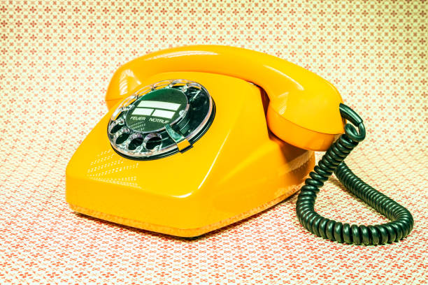 vecchio telefono arancione dalla germania - obsolete landline phone old 1970s style foto e immagini stock