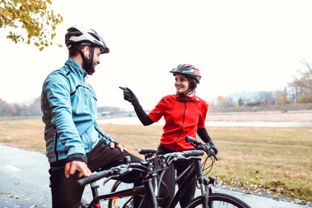 istock Fun Times For Cyclist Couple In Park 1200136661