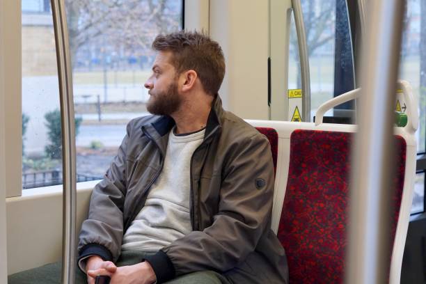 istock Man with a beard riding the streetcar downtown Toronto 1200139033
