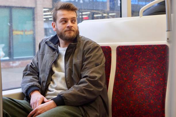 istock Man with a beard riding the streetcar downtown Toronto 1200139053