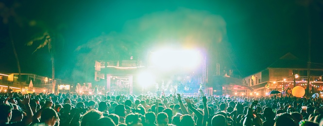 Many people enjoy outdoor music festivals in the night