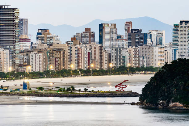 Santos SP Brazil at dusk Santos - SP, Brazil - November 21, 2019: Aerial view of Santos SP Brazil, Jose Menino beach, Paulista coast. City at dusk, when the lights of the city begin to turn on. groyne stock pictures, royalty-free photos & images