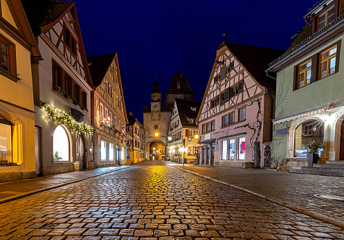 Old traditional medieval street in night illumination. Rothenburg ob der Tauber. Bavaria Germany.