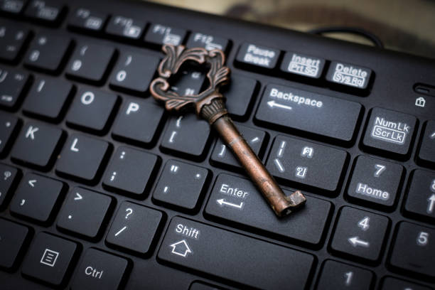 istock Close up old key and push-button the computer keyboard, Data protection by key concept 1200142157