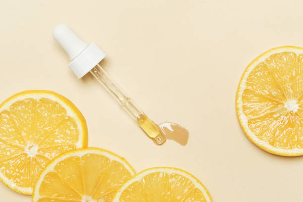 istock Lemon essential oil, Eye dropper pipette and lemon slices 1200142379