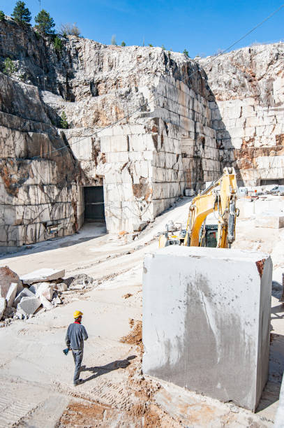 istock Quarryman Working in Marble Quarry - Stock Photo 1200143139