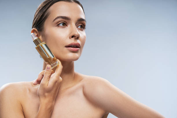 istock Caucasian attractive woman posing for camera against light background 1200145714