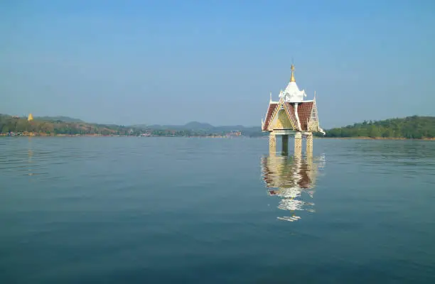 Photo of Landscape of Sangkhlaburi District of Thailand with the Bell Tower of Former Wat Wang Wirekaram Temple, Part of the Underwater City, Historic place in Thailand