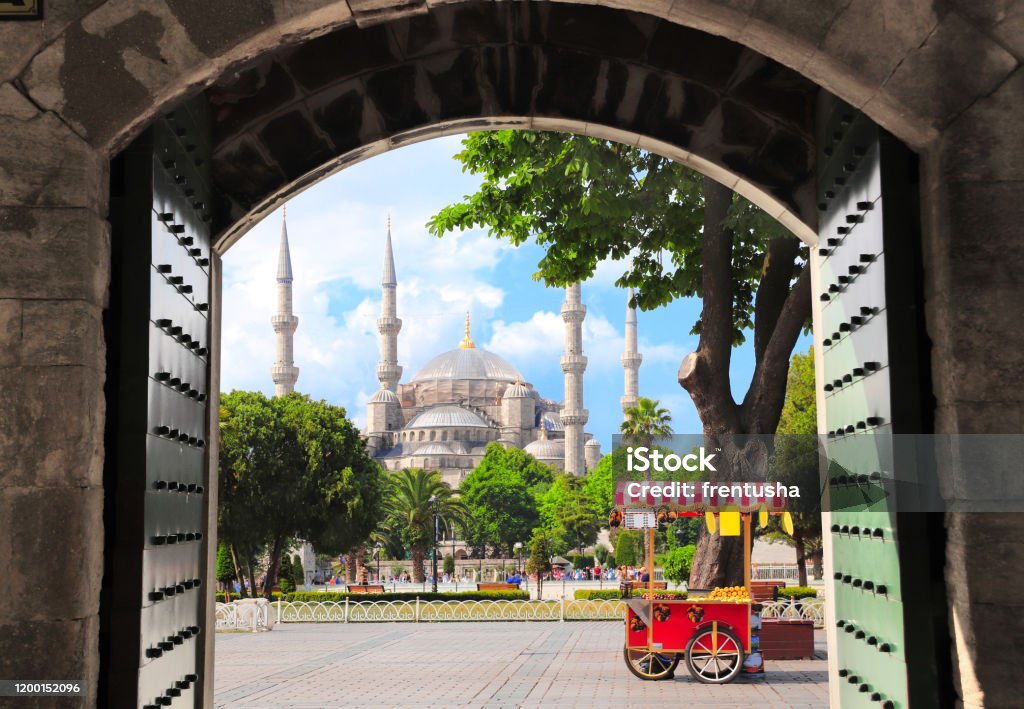 Blue mosque (Sultan Ahmet mosque), Sultanahmet Square, Istanbul, Turkey View through the old gate on Blue mosque (Sultan Ahmet mosque) and traditional turkish chestnut and corn cart, Sultanahmet Square, Istanbul, Turkey Istanbul Stock Photo Blue mosque (Sultan Ahmet mosque), Sultanahmet Square, Istanbul, Turkey View through the old gate on Blue mosque (Sultan Ahmet mosque) and traditional turkish chestnut and corn cart, Sultanahmet Square, Istanbul, Turkey Istanbul Stock Photo