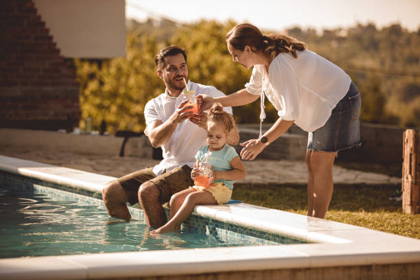 istock Cooling off with swimming pool and refreshing beverages on a hot summer day 1200154345