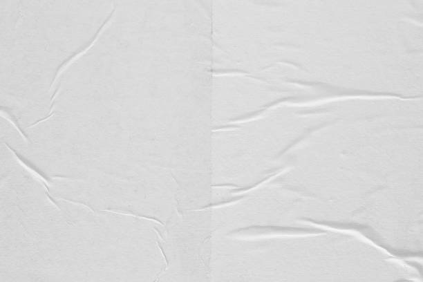 istock Crumpled white paper. Abstract background for the designer. 1200160042