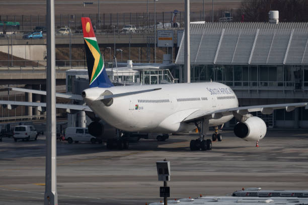 South African Airways Airbus A330-300 parking and boarding at Munich Airport Munich / Germany - February 5, 2018: South African Airways Airbus A330-300 parking and boarding at Munich Airport munich airport stock pictures, royalty-free photos & images